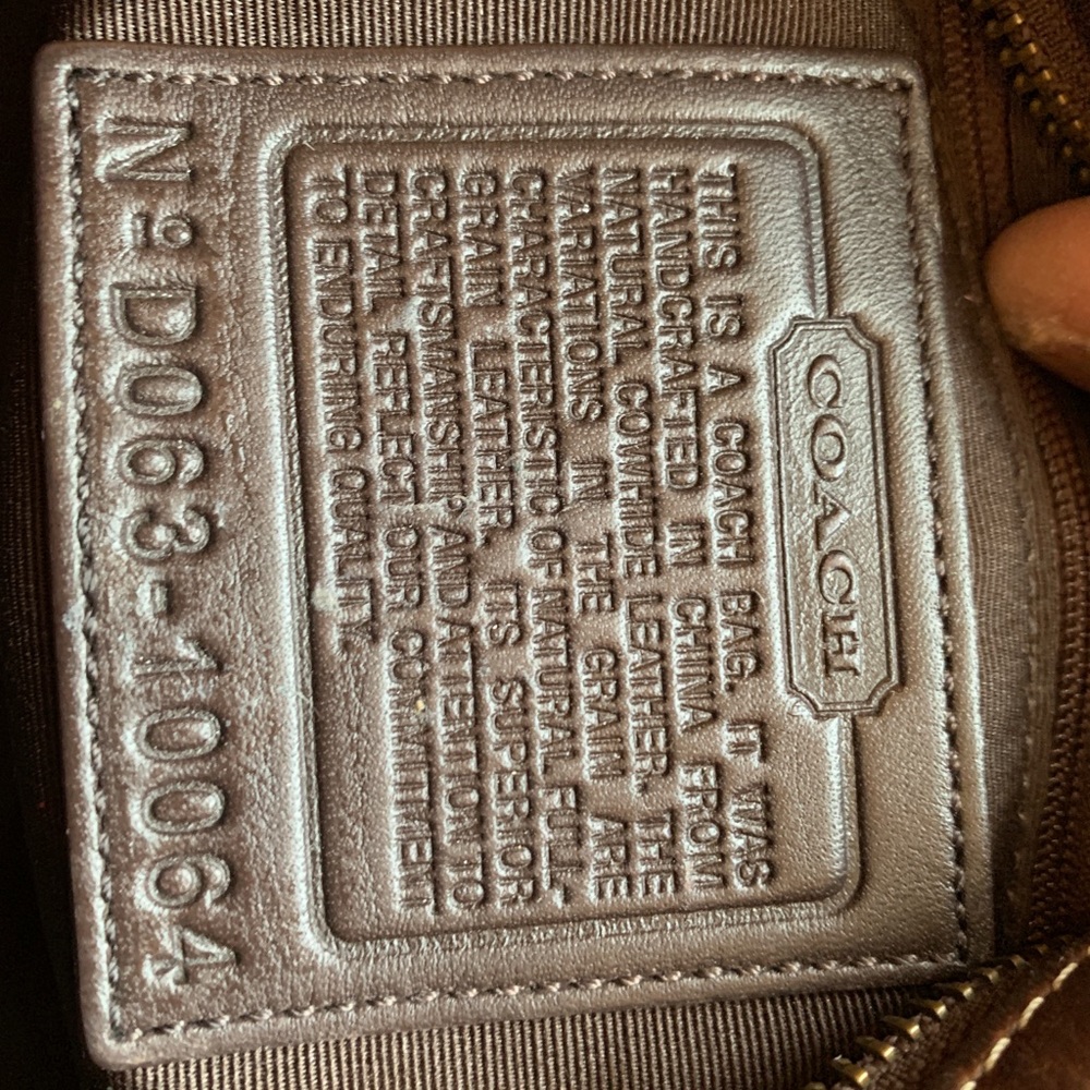 Brown leather Coach bag with details